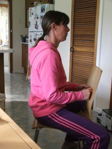 Donna riding position in chair