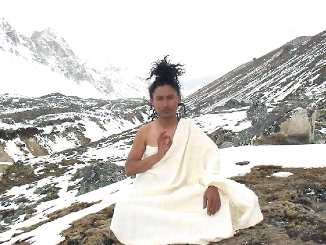 Tibetan monk in snow